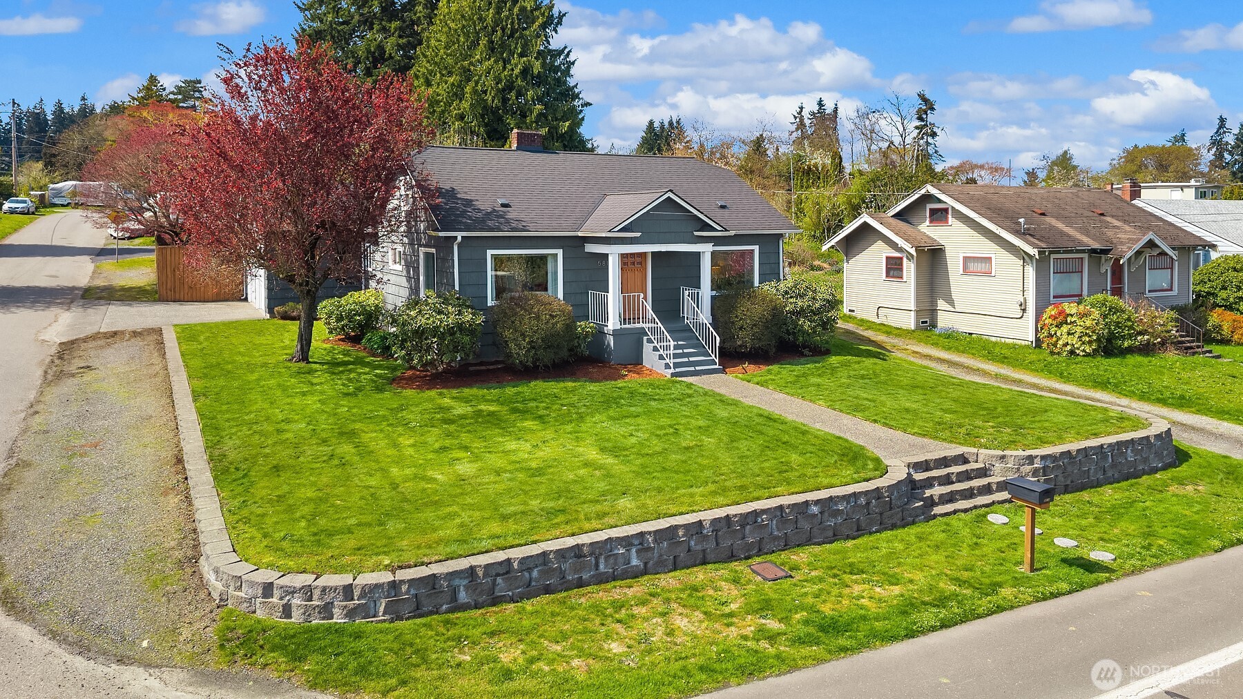 Corner lot home with ample off street parking & sprinkler system.