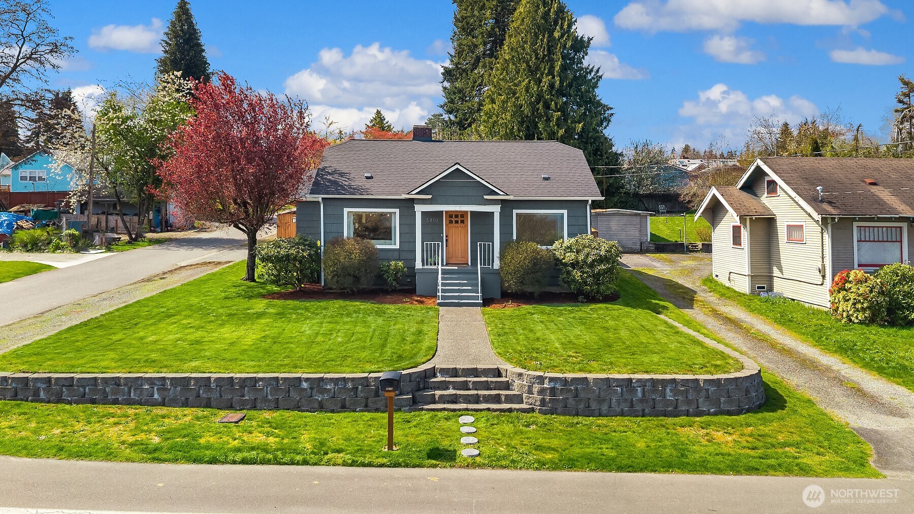 Corner lot home with spacious yard & sprinkler system.