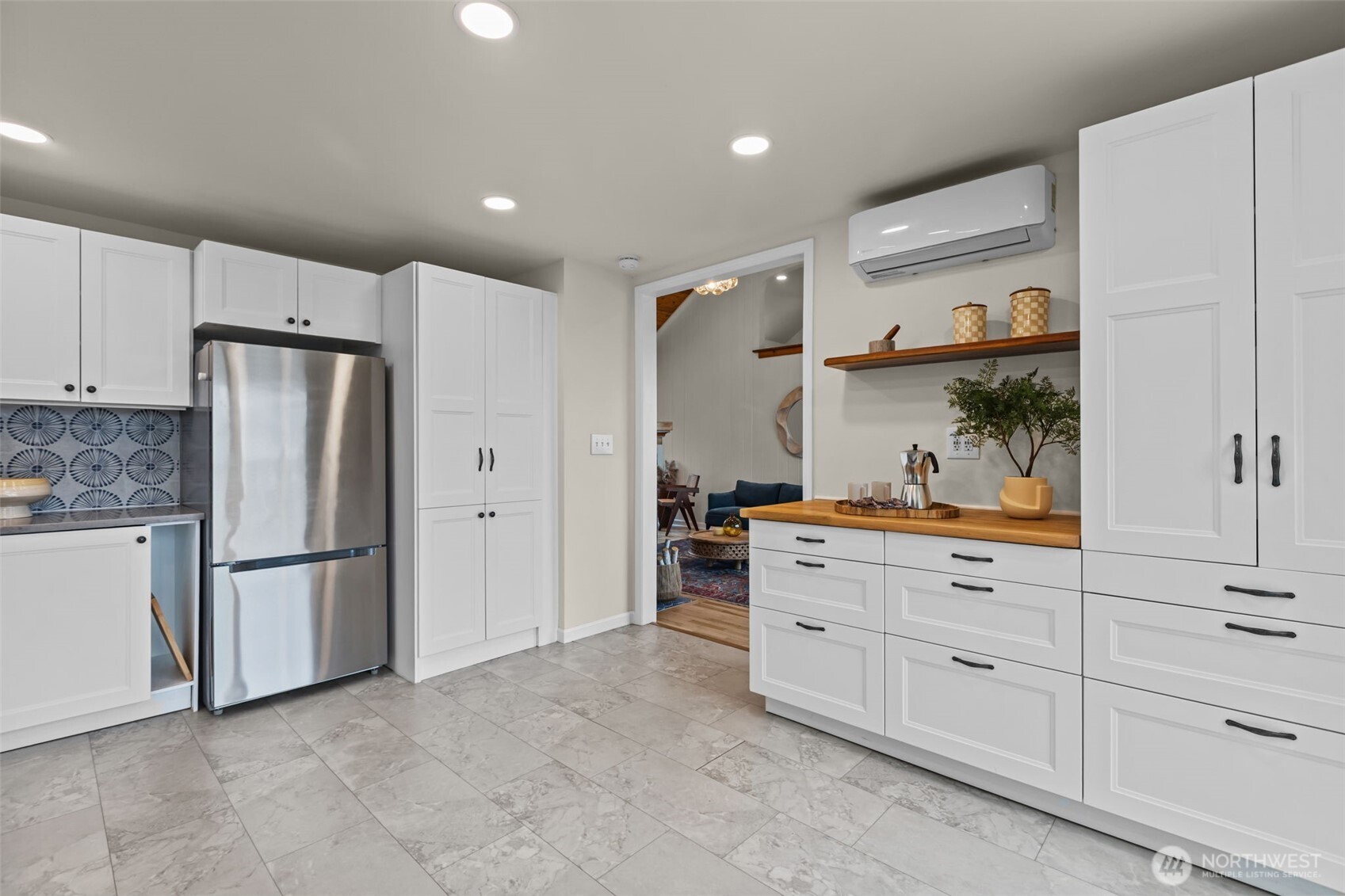 Thoughtfully placed recessed lighting ensures the entire space feels open and inviting, enhancing both form and function.