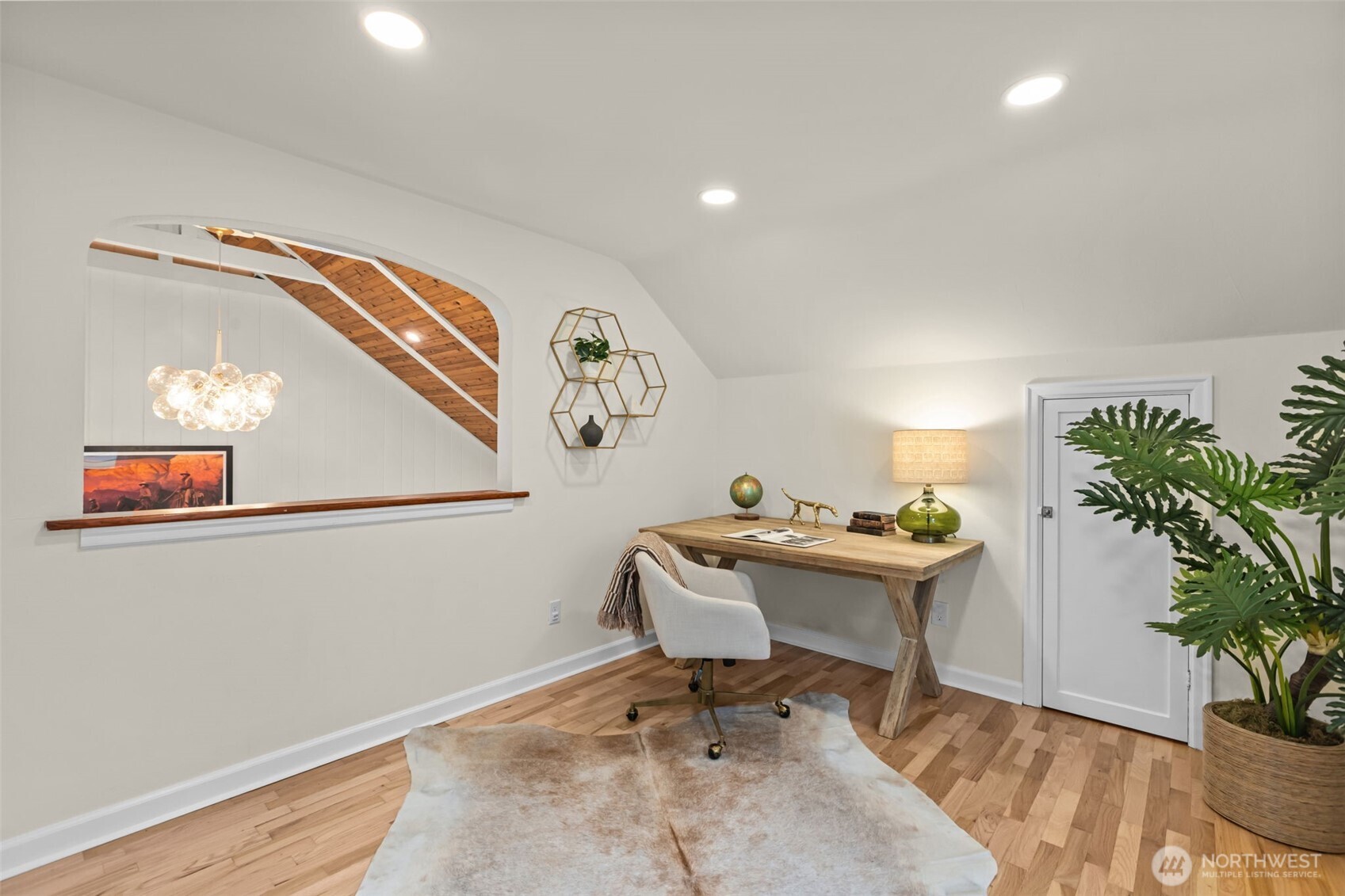 Arched architectural details. The arched opening adds a touch of storybook charm often associated with traditional cottages.