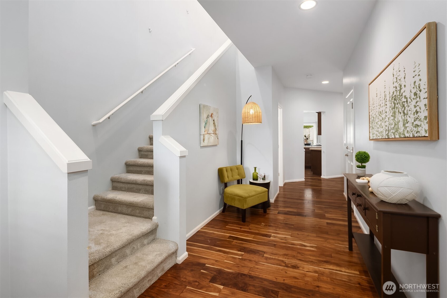A welcoming covered front porch and beautifully tended entry set the tone for the lifestyle this home offers—warm, inviting, and effortlessly comfortable. Framed by blooming landscape and classic Craftsman detailing, the approach feels both charming and refined. Morning coffee on the porch, neighbors passing by, a sense of arrival each time you come home—this is the kind of everyday living buyers hope to find. Thoughtful curb appeal, timeless character, and a gracious entry create a first impression that feels as special as the home itself.
