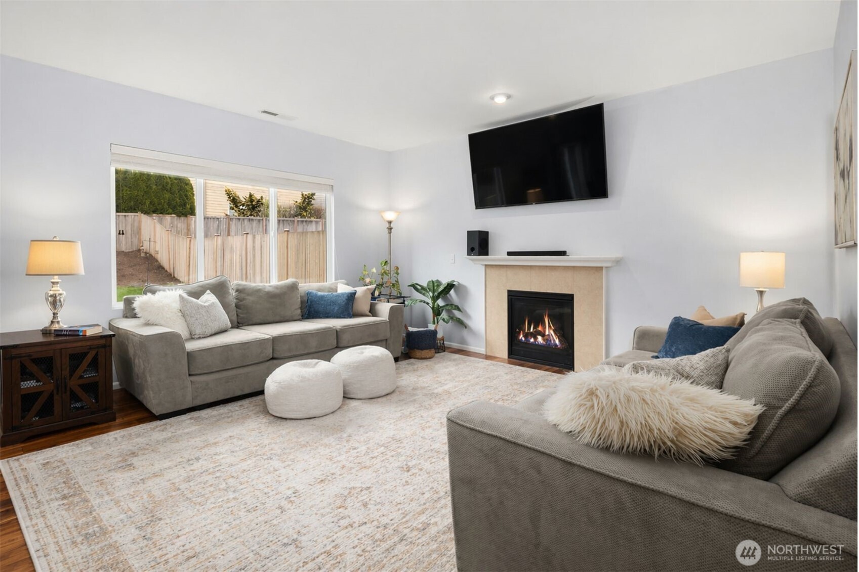 Step inside to an entry that immediately feels bright, welcoming, and thoughtfully designed. Rich hardwoods, soaring volume, and clean architectural lines create a sense of openness and calm, while the graceful staircase and warm finishes offer timeless appeal. This is more than a foyer—it’s an introduction to the way the home lives: comfortable, polished, and effortlessly functional. A beautiful first impression that sets the tone for the spaces beyond.