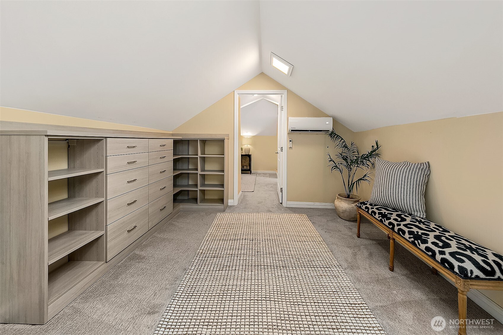 Lined with shelving, drawers and storage in the eaves ~ choose to create the most spectacular closet or a media room for game or movie nights.