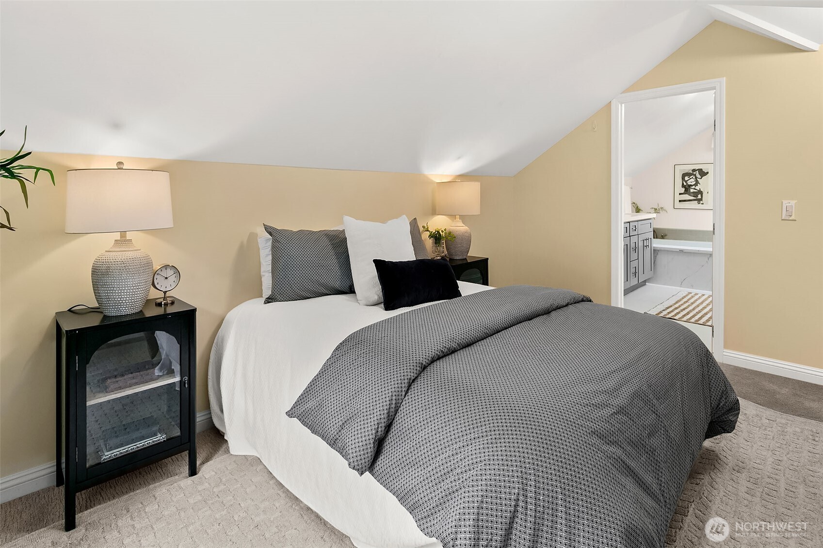 The primary bedroom has vaulted ceilings, a wall of closets and attached full bathroom.