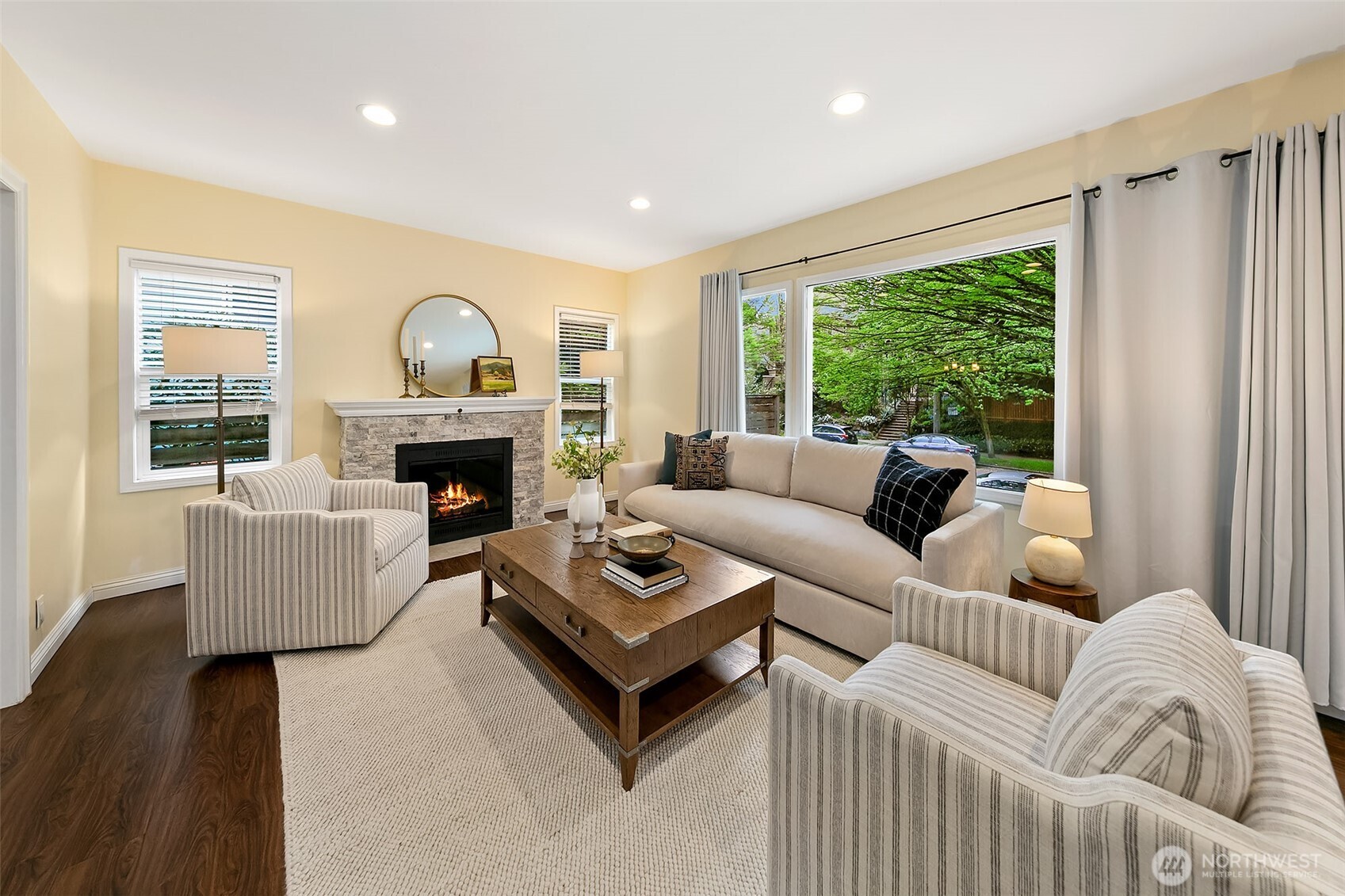 The main floor enjoys light from many directions through large picture windows.