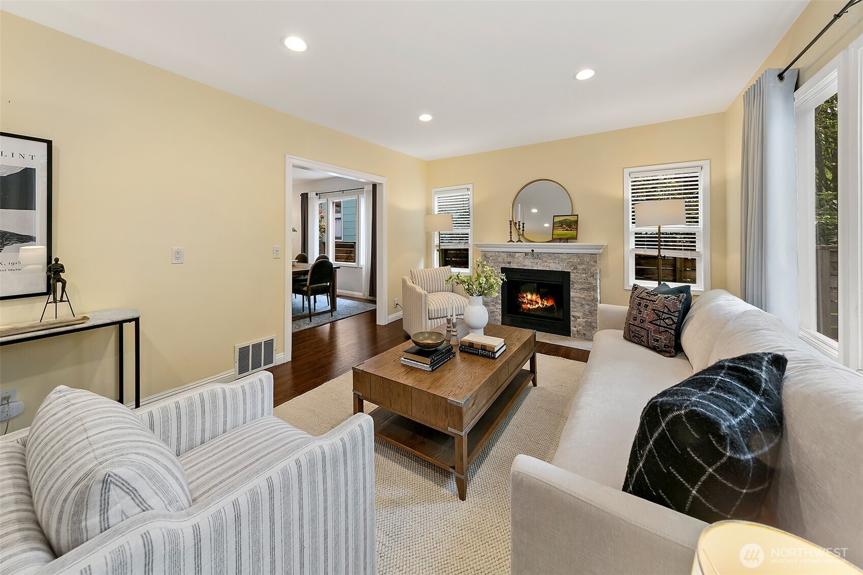 Centered on the gas fireplace and large picture window; creating a warm and inviting feel.
