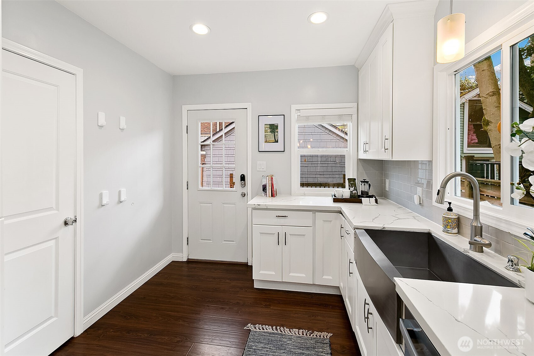 Kitchen with direct access to the back deck, garage and yard. So convenient!