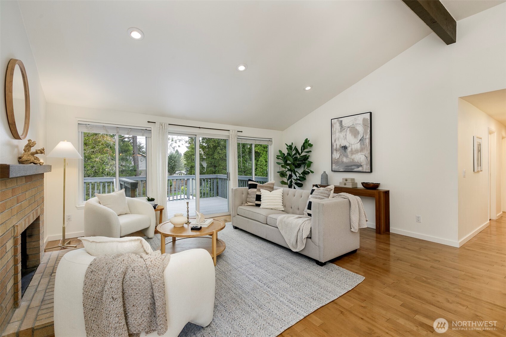 Walk out to large deck and beautiful entertainment back yard.