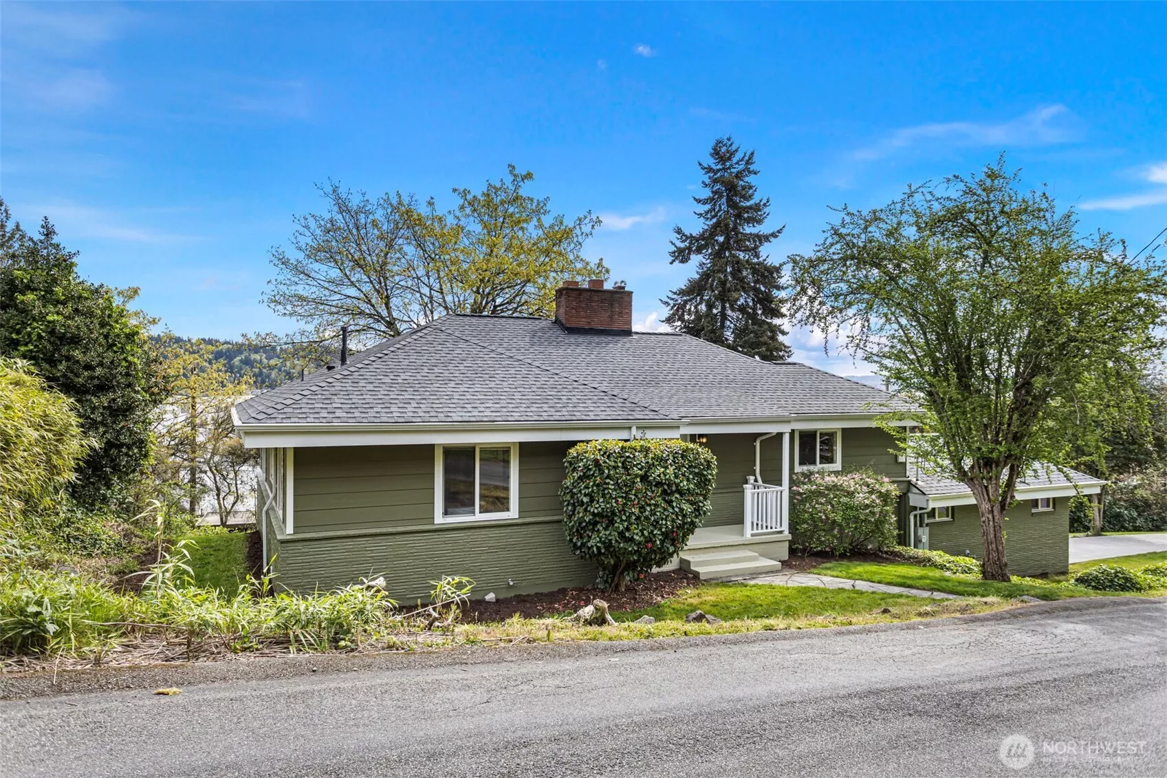 Located along the Burke-Gilman Trail on coveted Lakeside Ave, this beautifully updated home offers water views from every level.