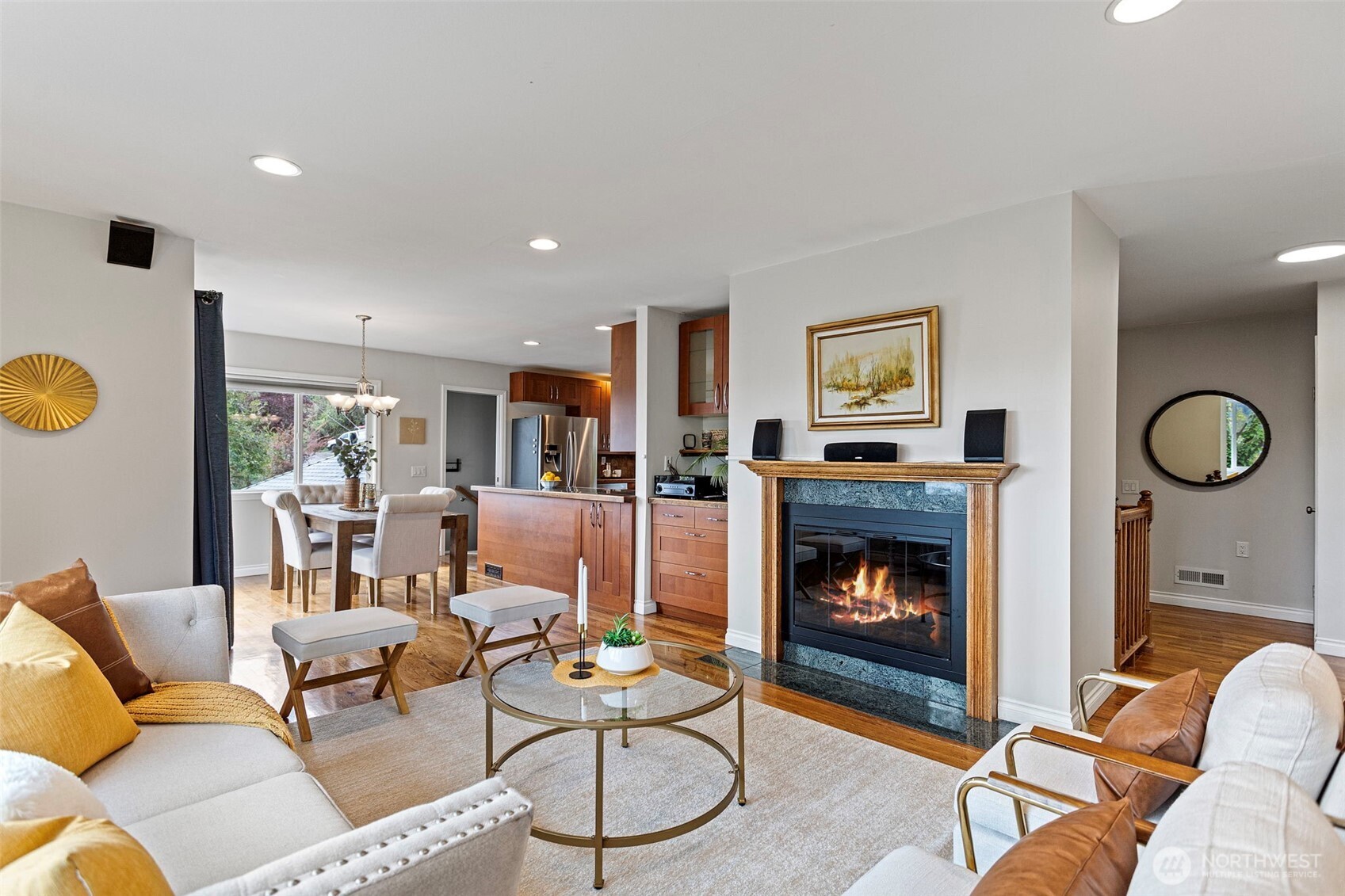 Centered around a fireplace and opening up to the dining area and kitchen, this open floor plan is ideal for convenient every day living and entertaining!