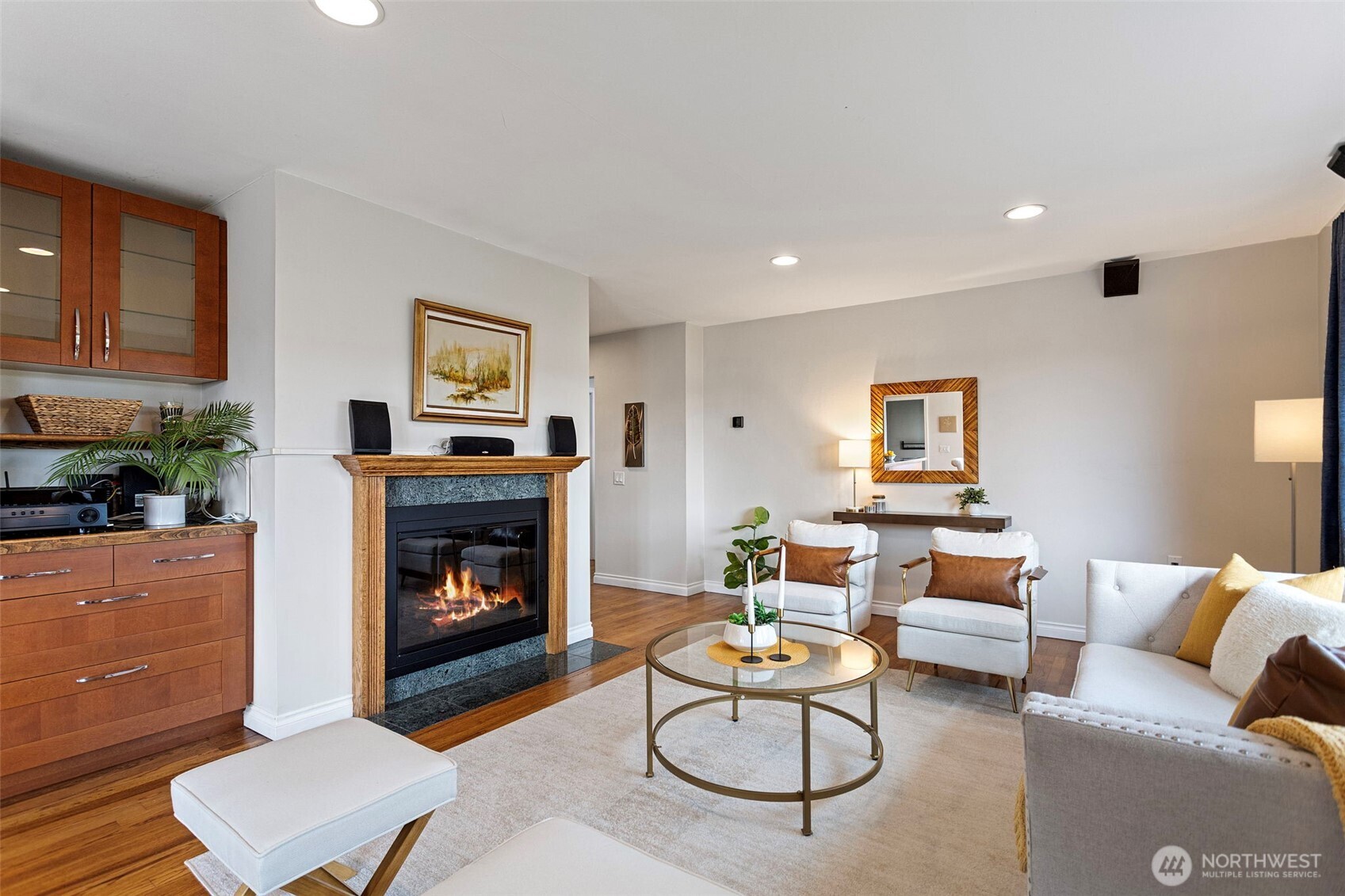 Cozy up around the fireplace and listen to your favorite music, hooking up to the media console and speakers that convey with the home.