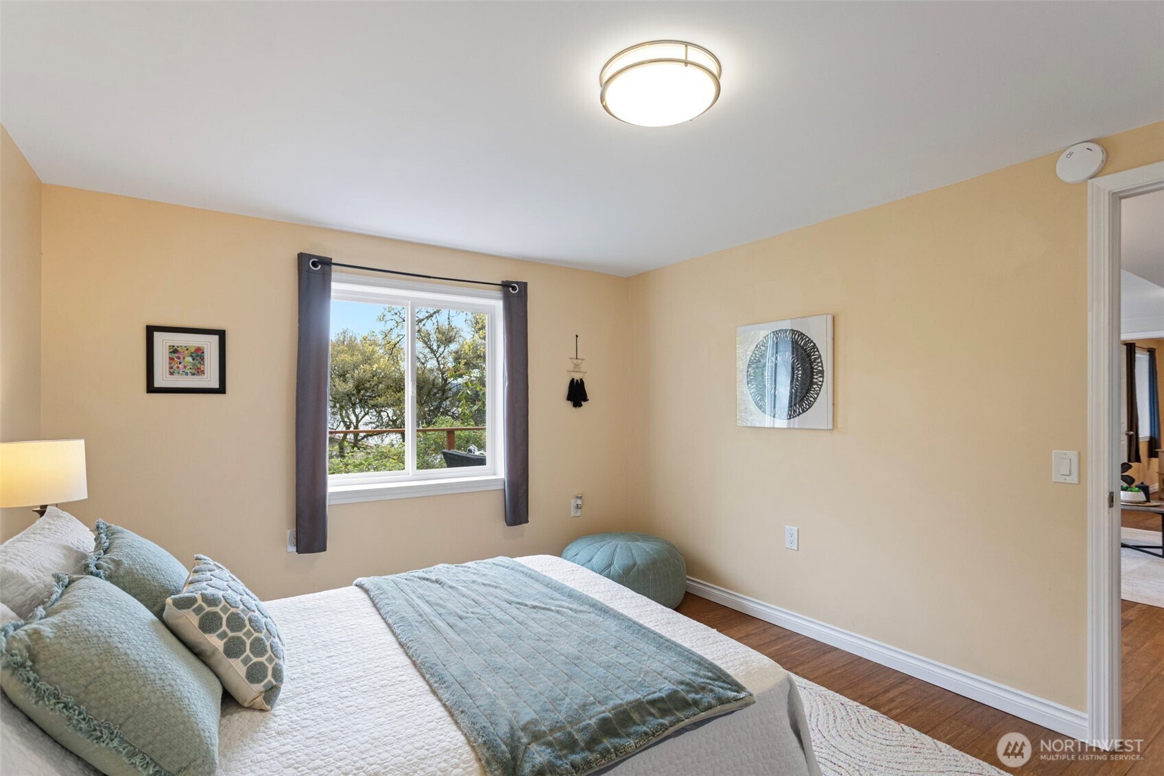 The second bedroom on the lower level with views of the water.