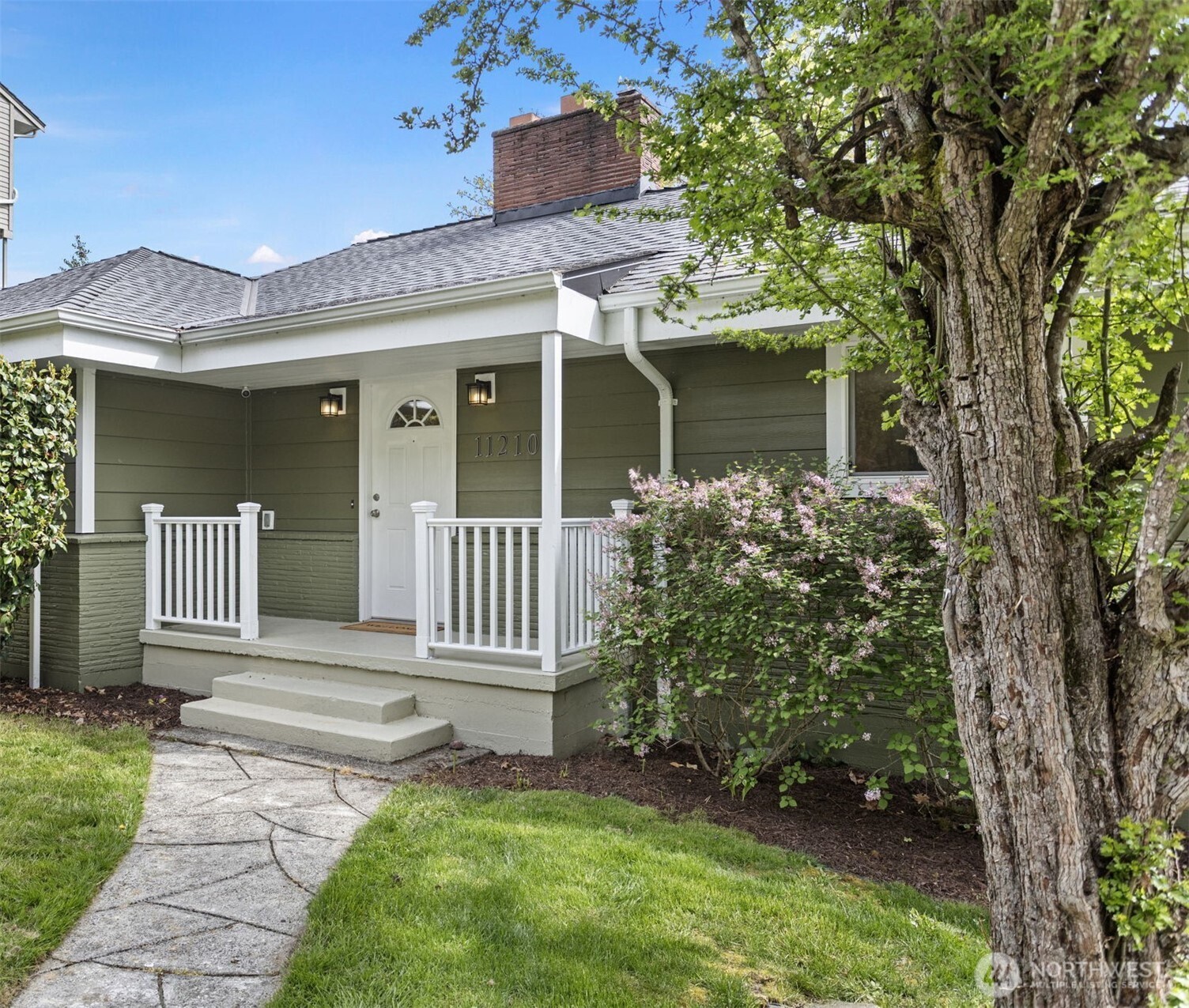 Comfortable covered front porch with room for seating. New front door hardware welcomes you into an spacious entry with a  convenient coat closet.