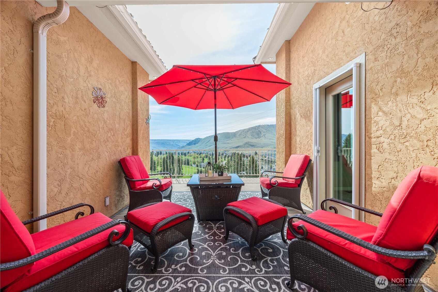 Private and inviting patio retreat offering a cozy outdoor living space perfect for relaxing or entertaining. Framed by warm stucco walls, this charming setting createsa welcoming atmosphere for morning coffee or evening gatherings. With easy access from the home and a tucked-away feel, this outdoor space provides both comfort and privacy.