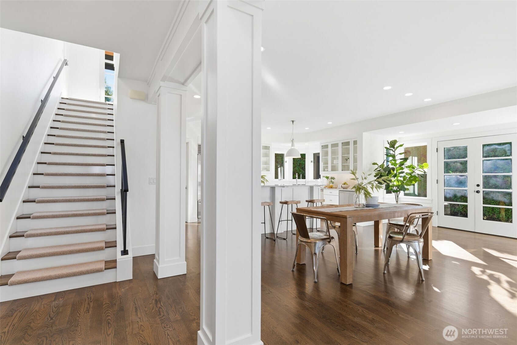 Hardwood staircase with white risers and easily removeable/re-attachable wool treads.