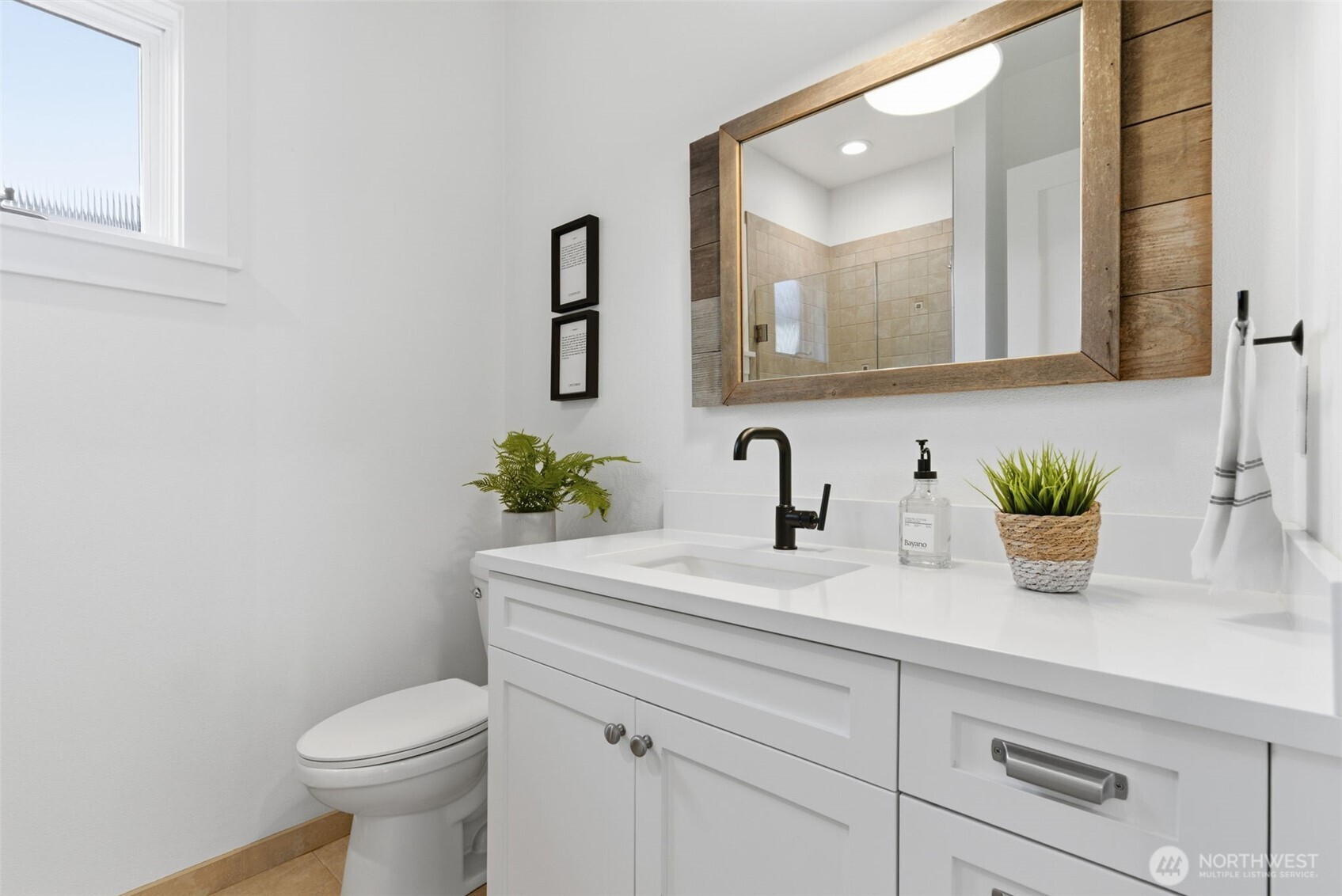 Hall bath with tiled shower.