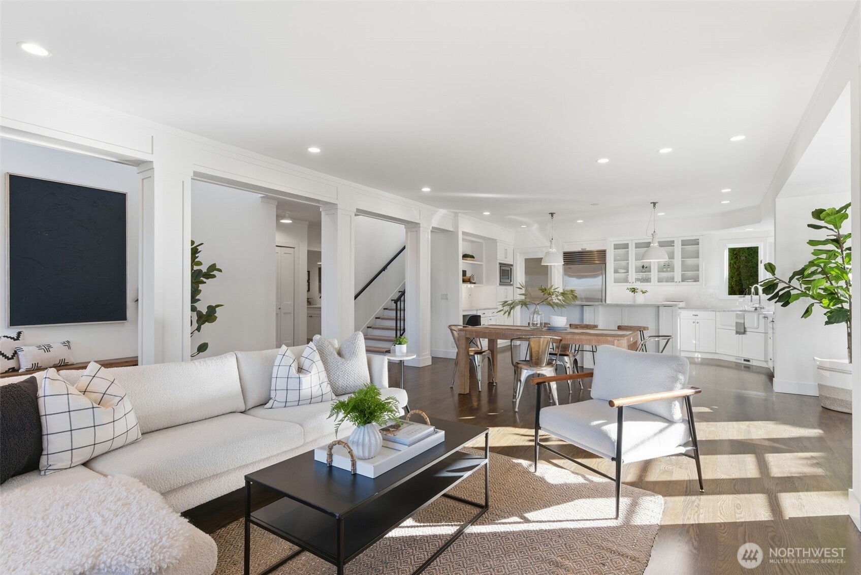 Inside, a great room washed in natural light and neutrals. Site-finished white oak floors are throughout the main and upper levels.