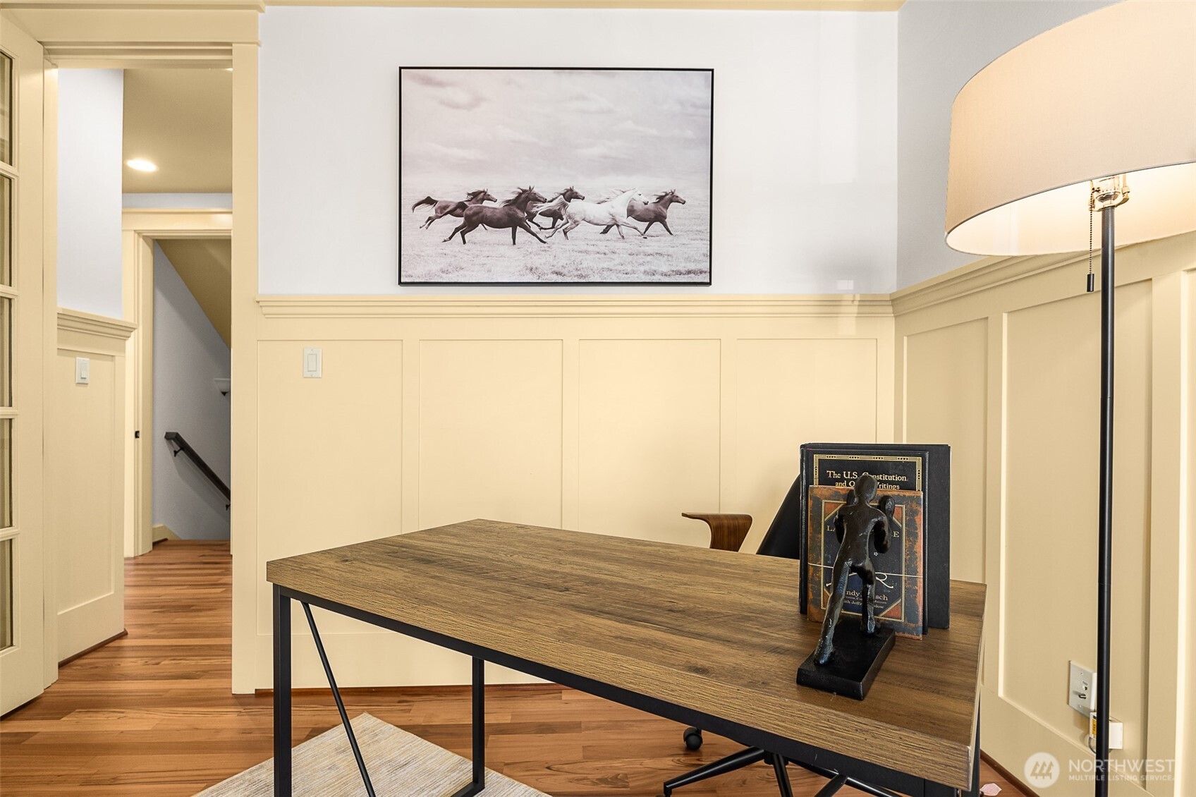 The main level bedroom or den with a closet and direct access to the porch.