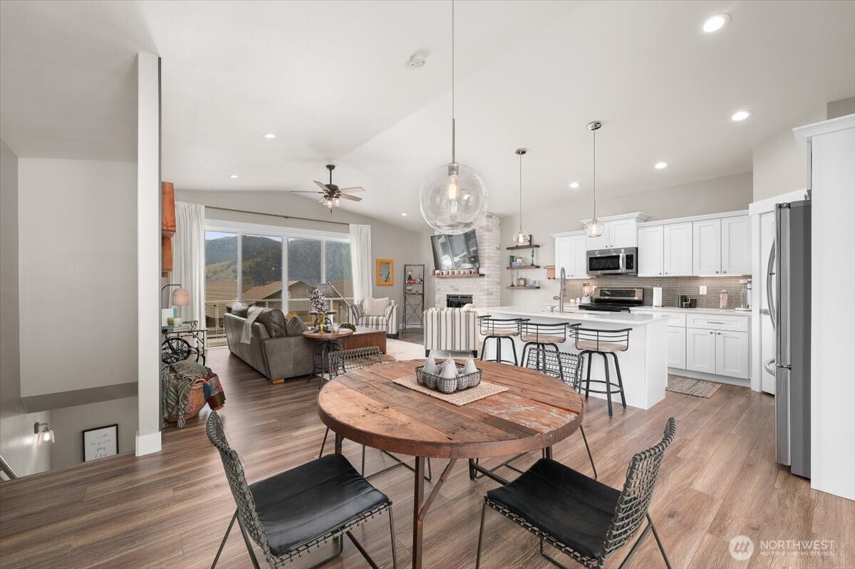 The main level has an open layout that connects the kitchen, dining, and gathering areas.