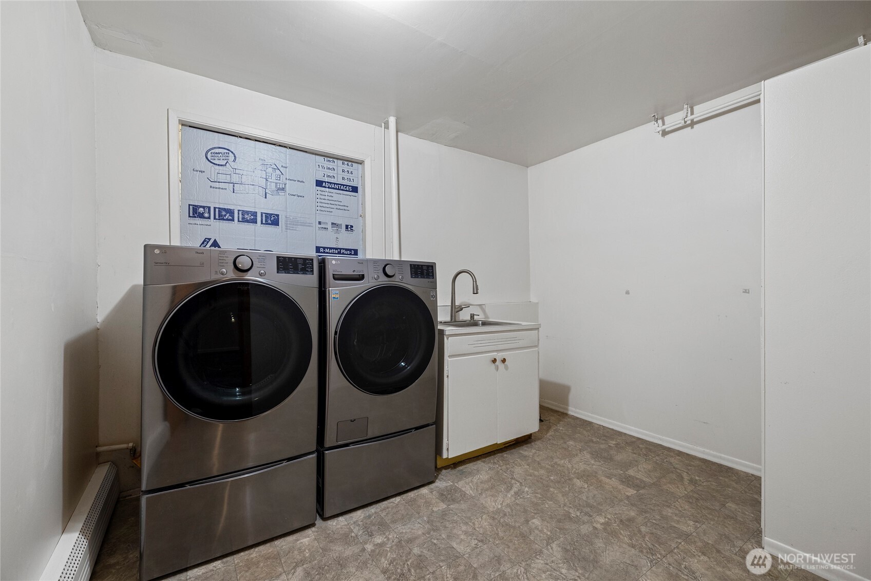 Lower level laundry room plumbed for a toilet