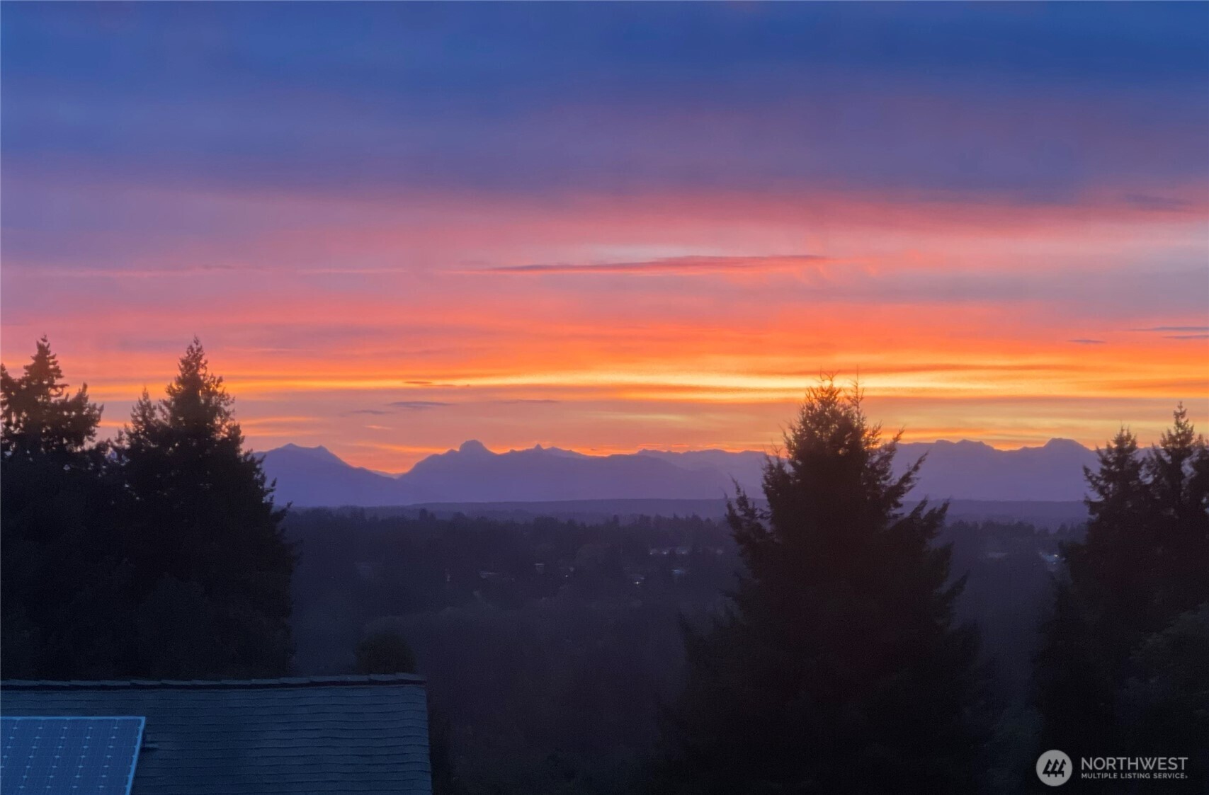 Owner provided sunset images, shot from living room.  NOT from drone.