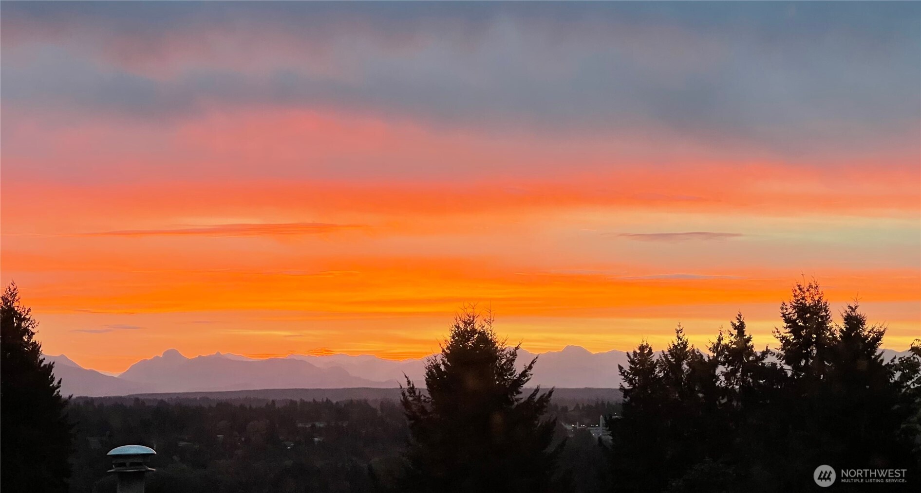 Owner provided sunset images, shot from living room.  NOT from drone.