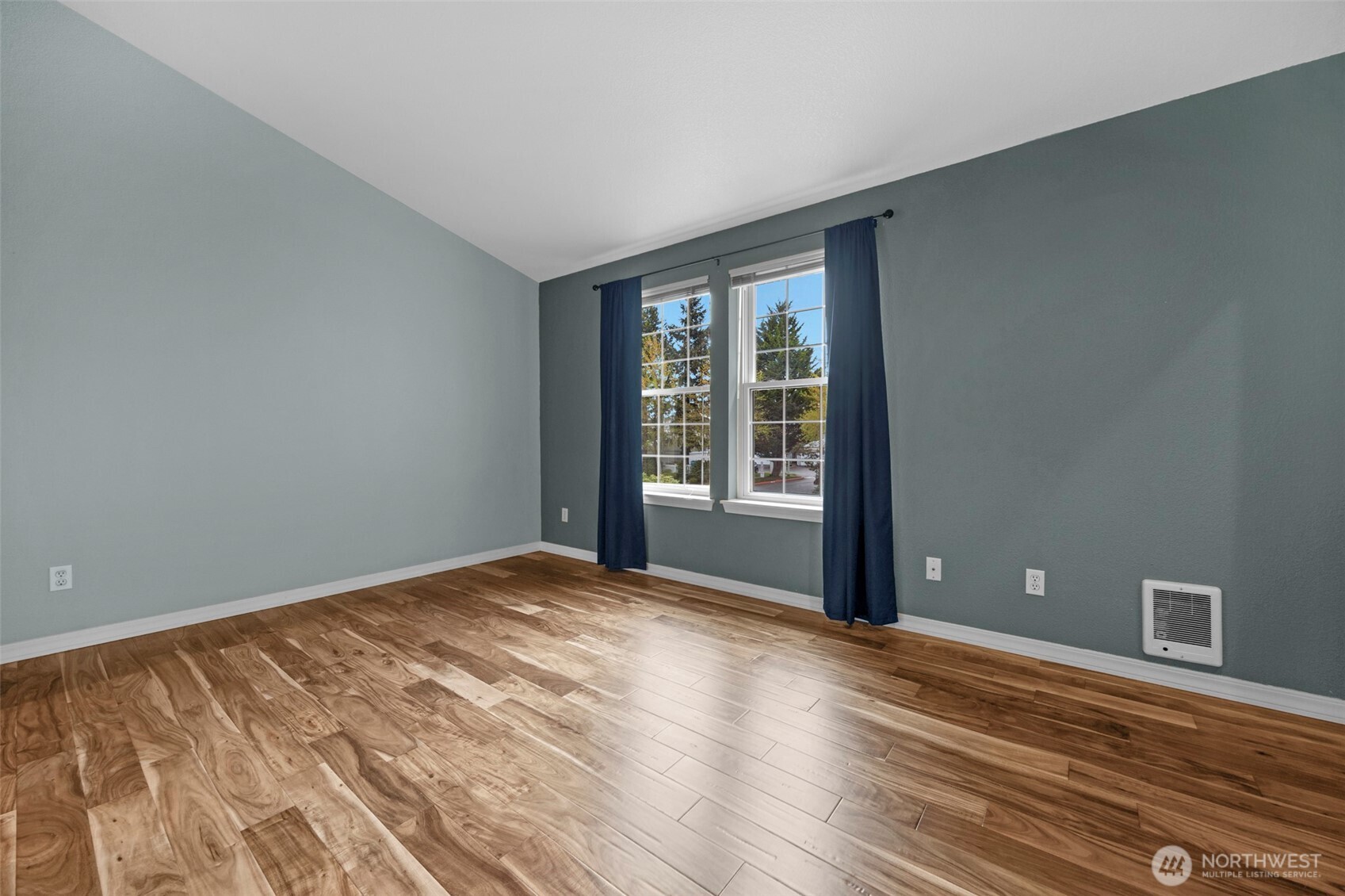 First of the two large primary bedrooms with attached bath.