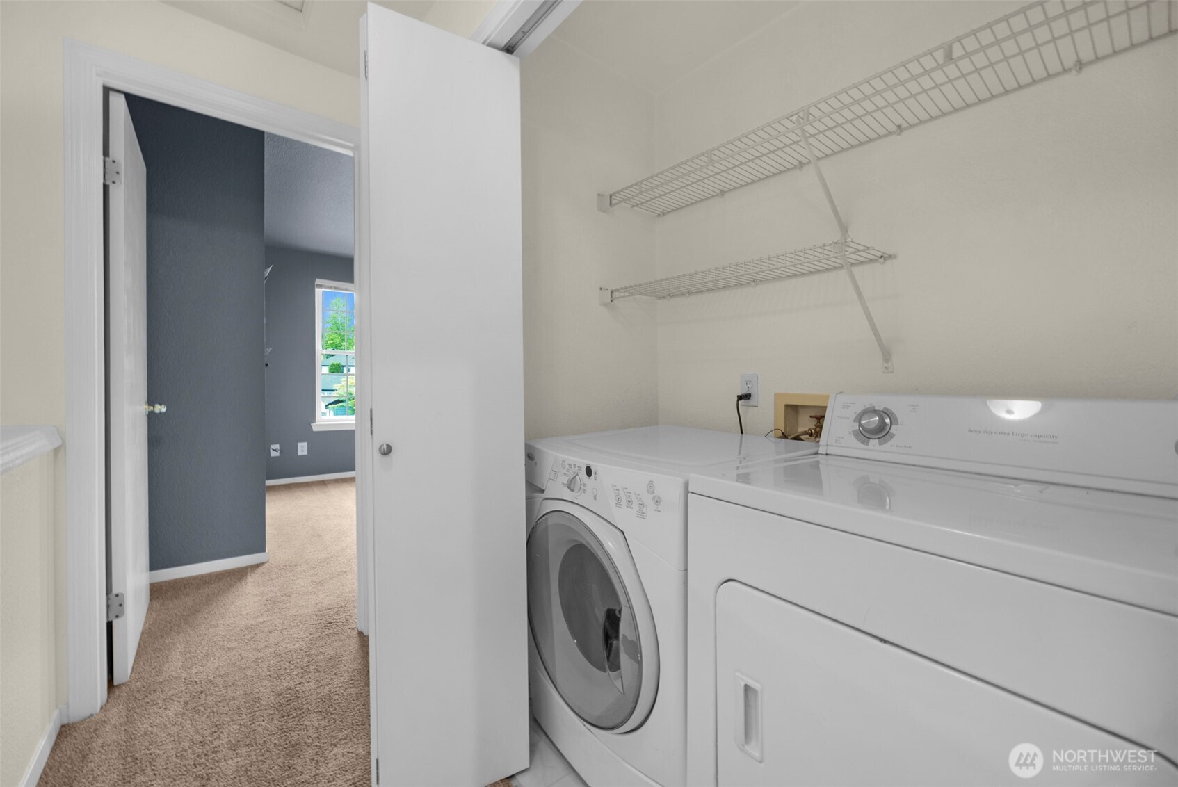 Full size washer and dryer between the bedrooms on the upper level.