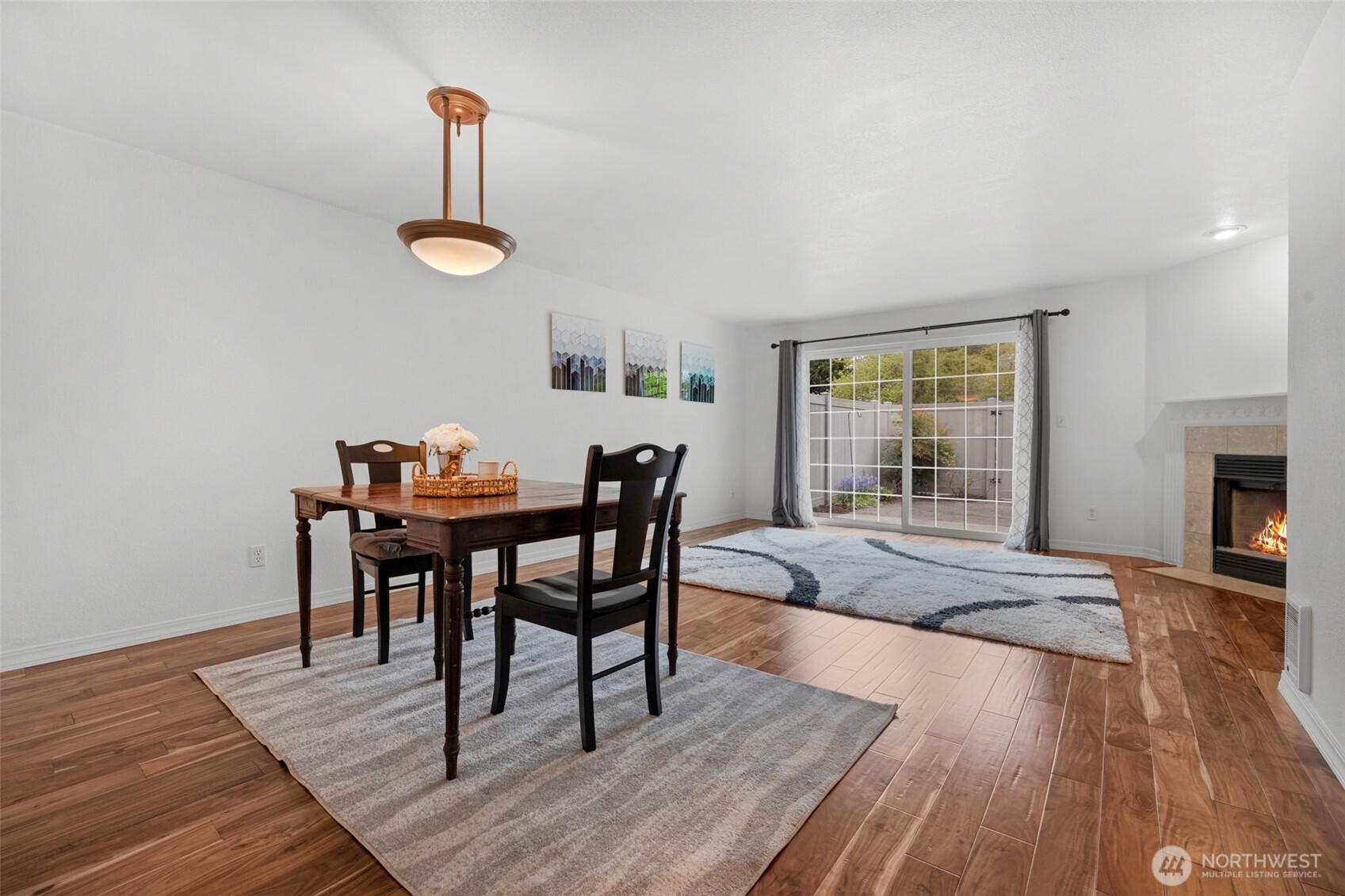 Lovely open living and dining room spaces that look out onto the private outdoor patio.