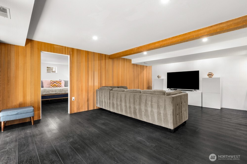 The second primary suite is tucked away for added privacy and comfort.
