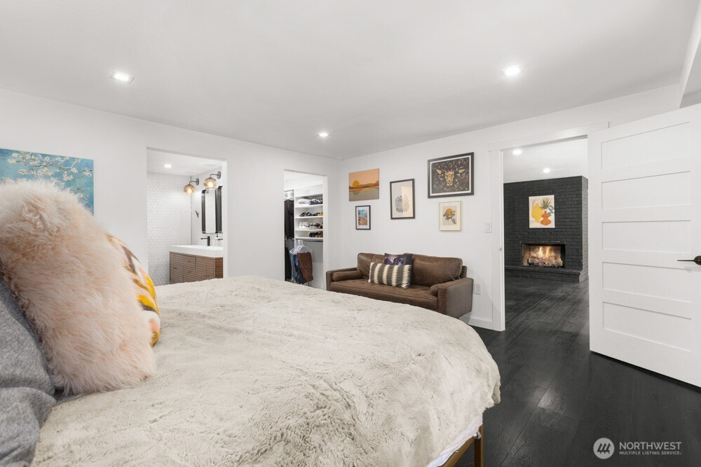 A peaceful retreat featuring a spacious walk-in closet and a beautifully tiled bath