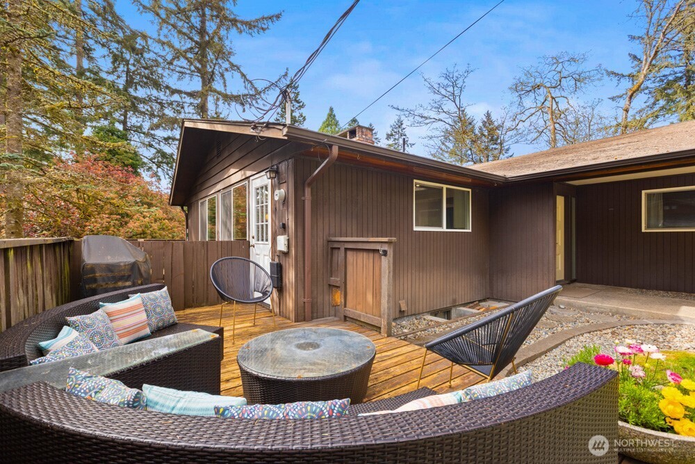 Out front, a private deck area adds another inviting space to relax.