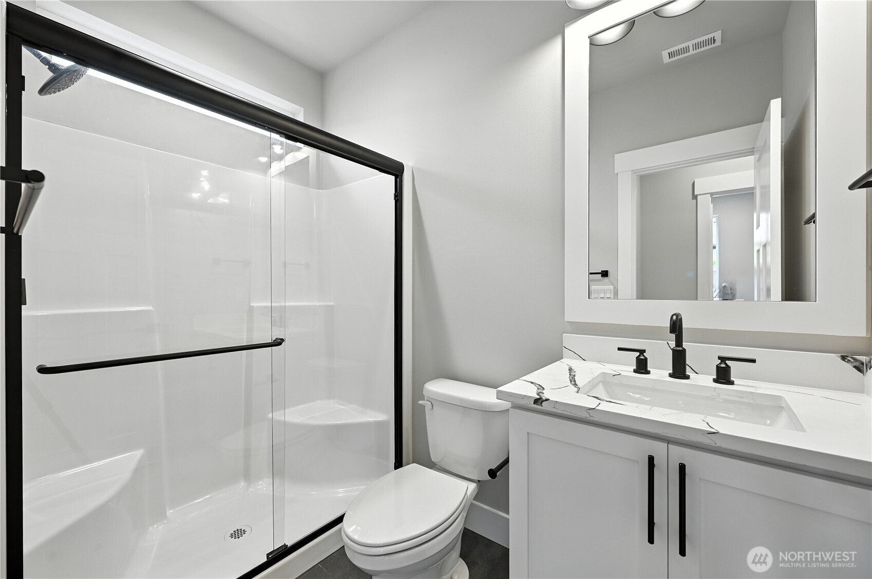 Main Floor 3/4 Bath - photos of same plan built on a different lot. Details will vary