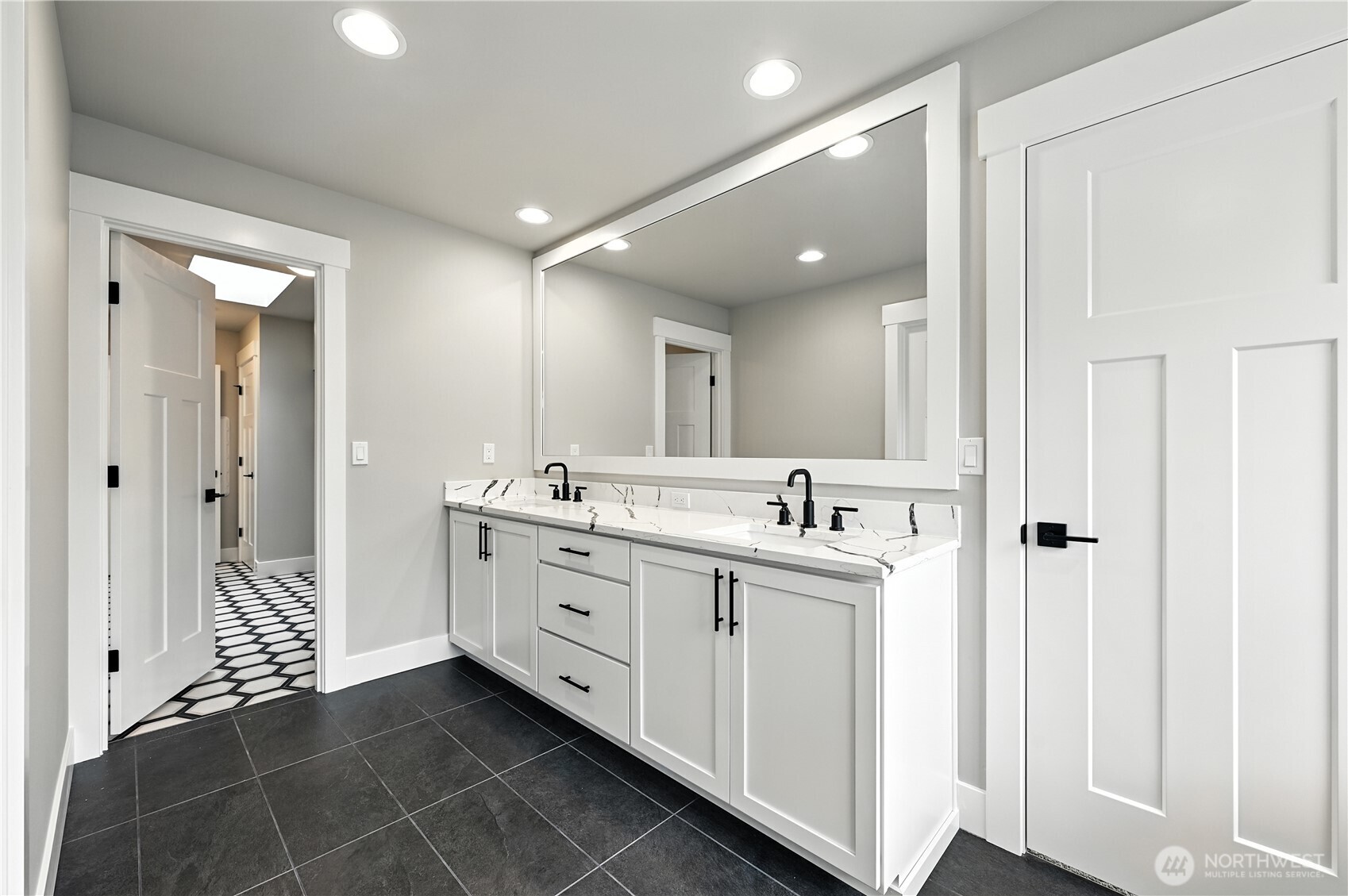 Primary Bathroom connects to upstairs laundry room