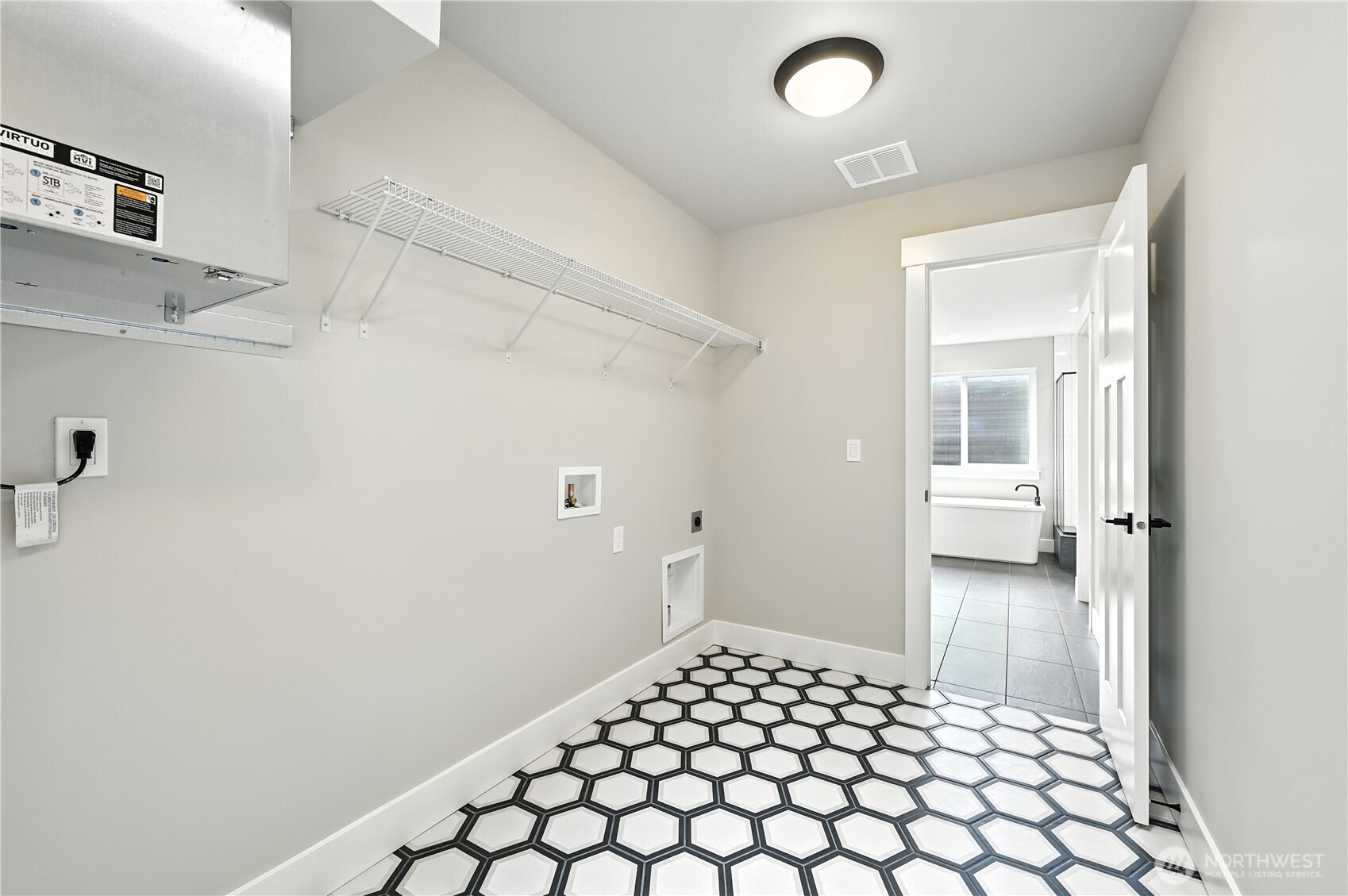Convenient Upstairs Laundry Room connects to Primary Bathroom