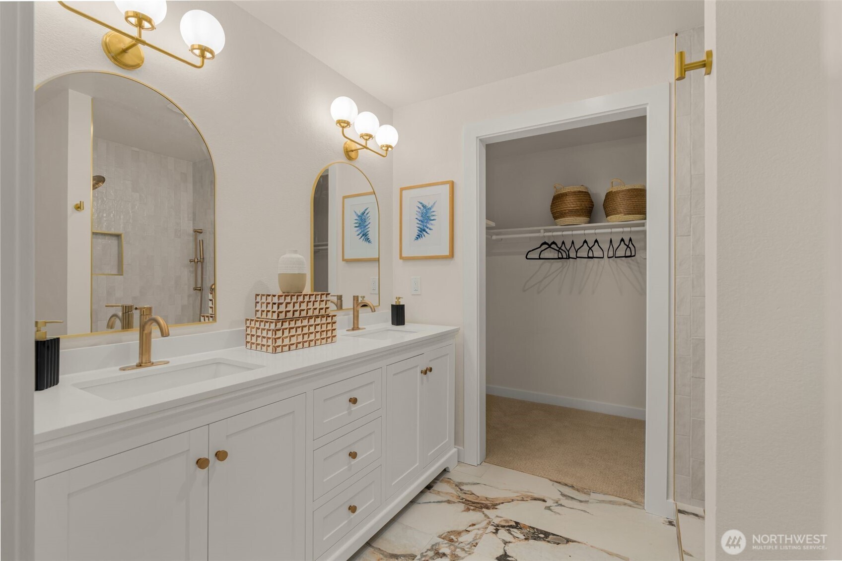 Double vanity and walk in closet in the primary bedroom