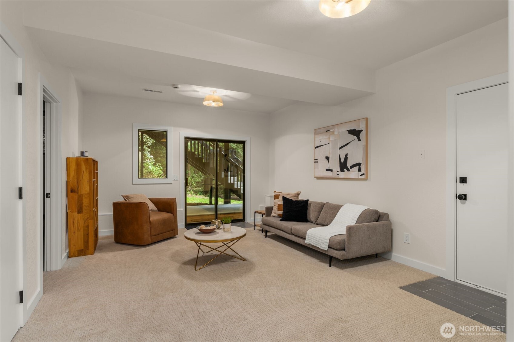 Roomy den in the basement would make a great media/entertainment space