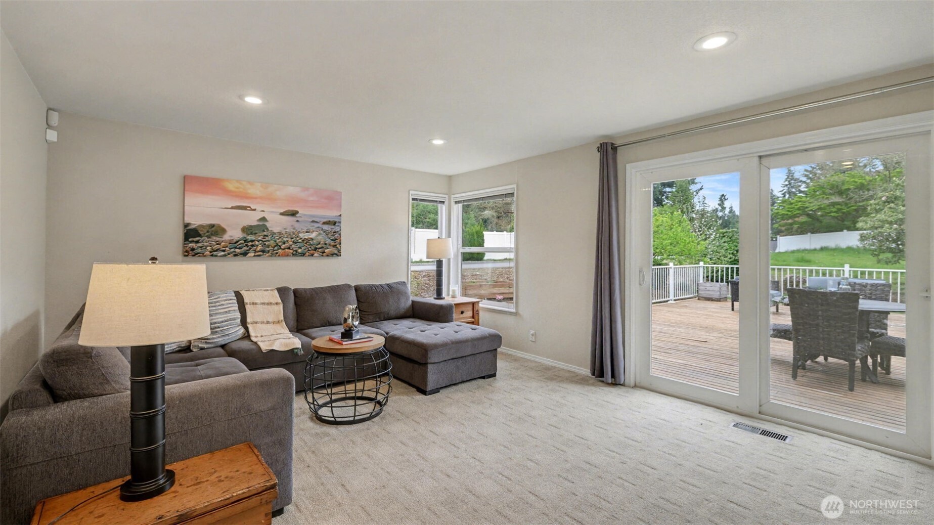 Comfortable family room with sliding doors leading to the newer deck.