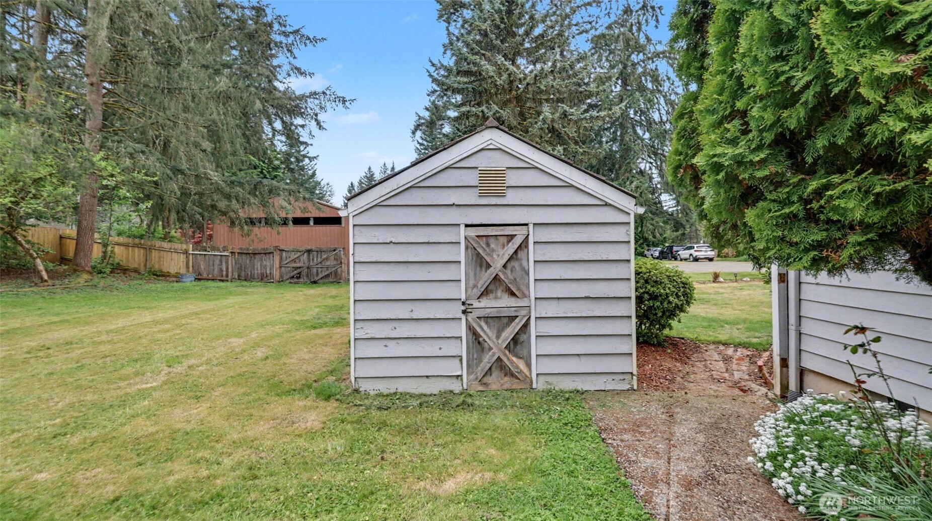 Large shed is perfect for storing your lawn mower and garden tools.