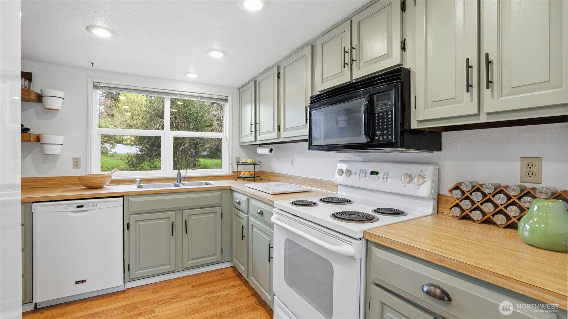 Natural light, views of the expansive backyard, and tons of counter space make this a welcoming space for daily life.