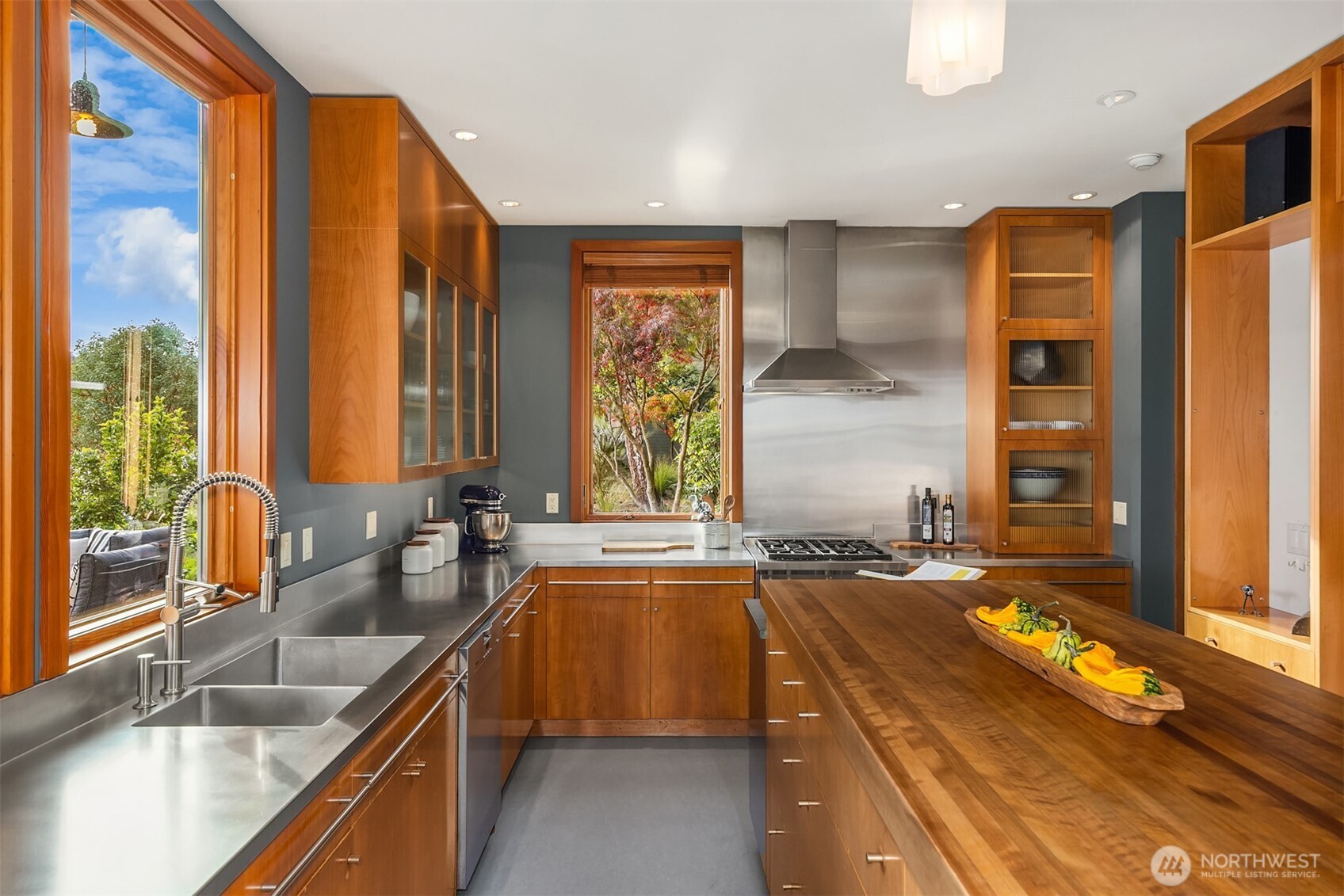 The kitchen features stainless steel and German greenstone countertops.