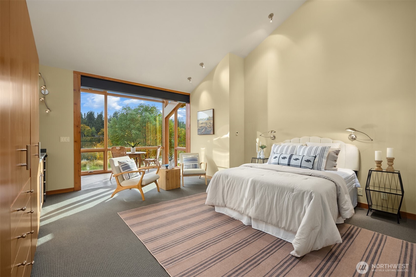 The guest space/studio mirrors the same high-quality finishes and attention to detail as the main home, featuring built-ins, a kitchenette, and a sleeping loft (not shown).