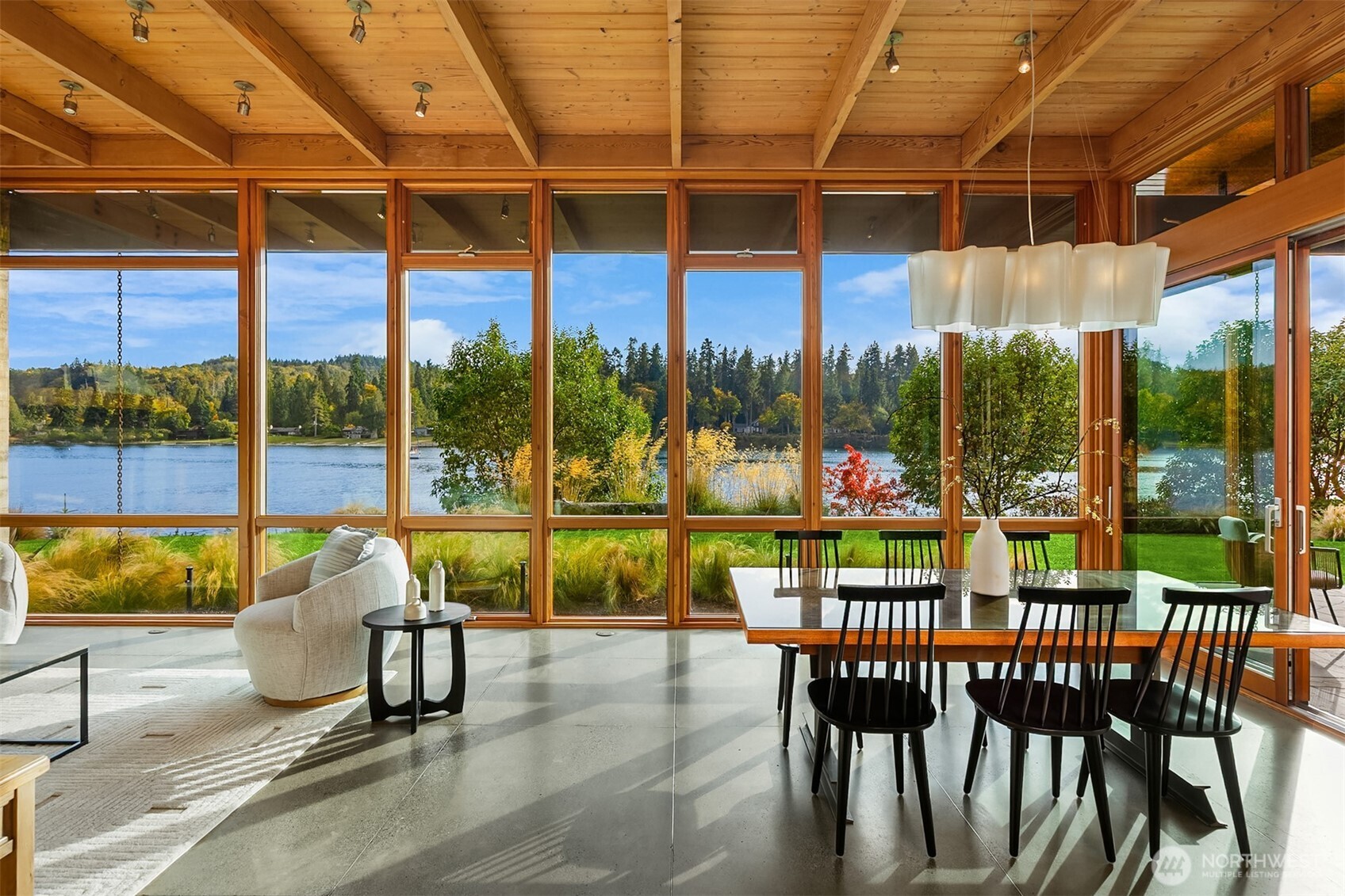 Dramatic floor-to-ceiling walls of glass in the dining/great room.