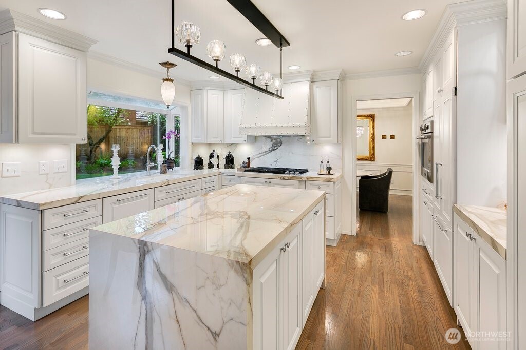 Miele dishwasher, Fisher & Paykel refrigerator, Frigidaire oven and, KitchenAid cooktop