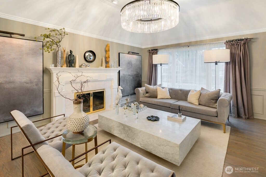 Formal living and dining areas refreshed with updated paint, flooring, and lighting