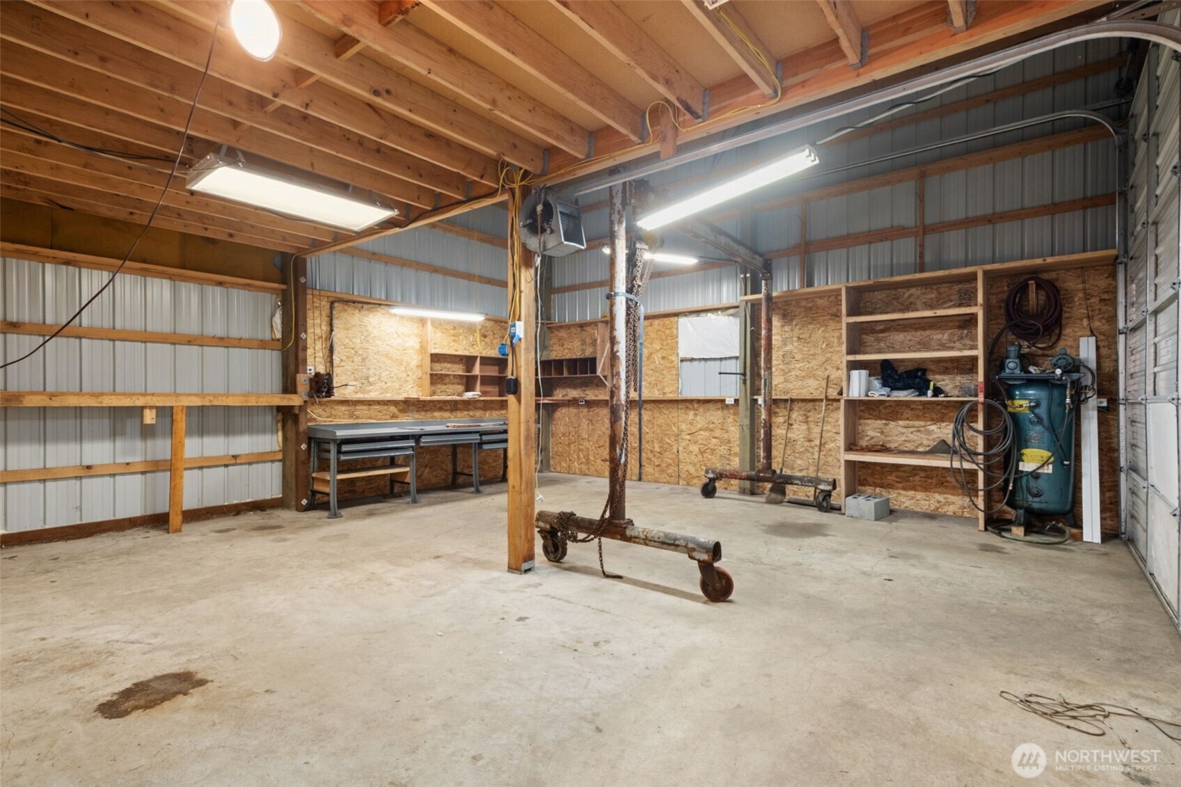 Spacious shop interior with high ceilings and room for equipment or projects.
