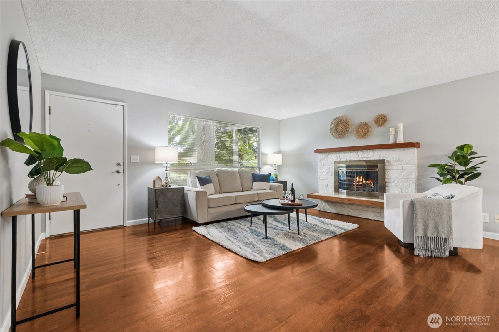 Light-filled living room with beautiful flooring and an open, airy feel.