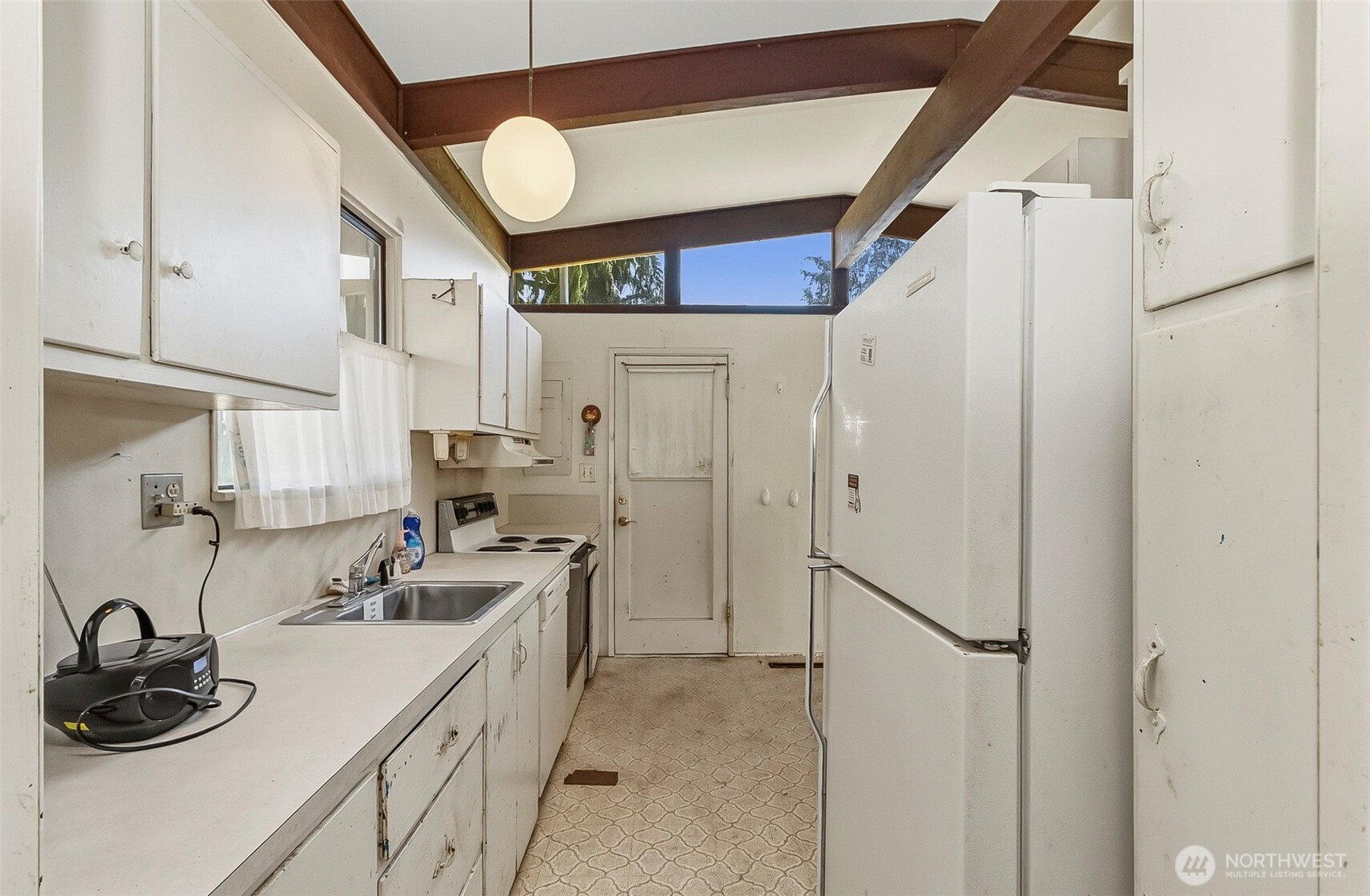 Galley Style Kitchen looking to the Side Door