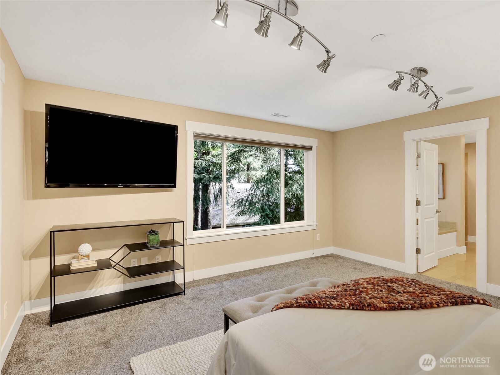 Spacious primary suite with room to unwind and recharge