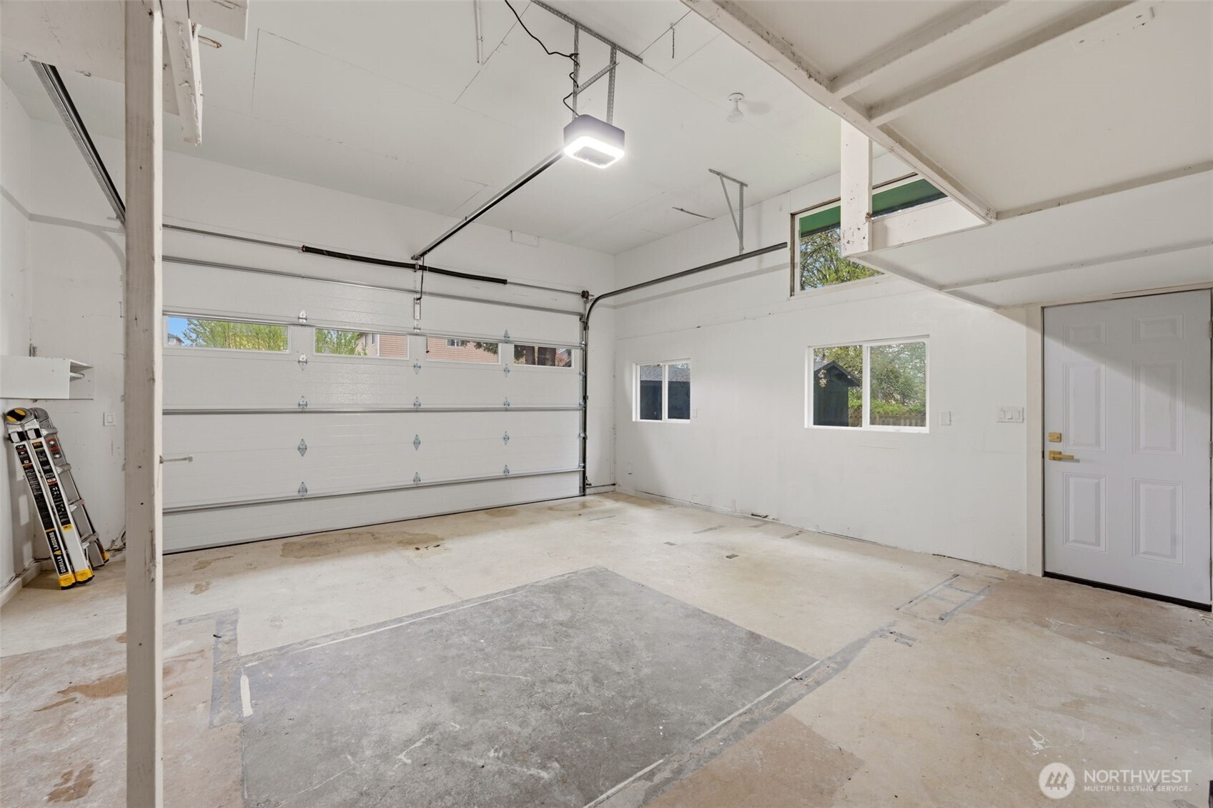 Huge garage with tall ceilings. Brand new door and opener.
